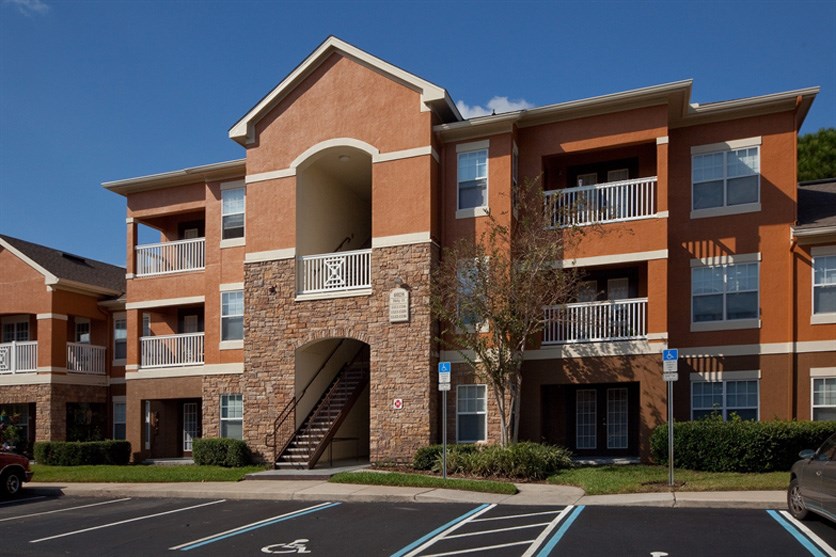 Woman Reviewing Lease outside of orlando apartment