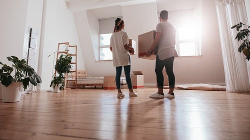Choosing a Moving Company Couple with Moving Boxes