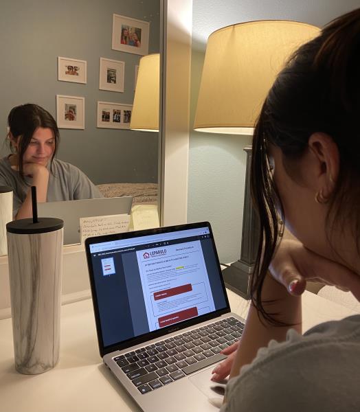 Review Your Lease Tenant reviewing their lease terms before move out